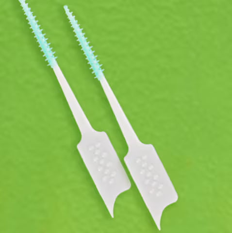 THE INTERDENTAL BRUSH USE IT TO REACH UNCHARTED SPACES
